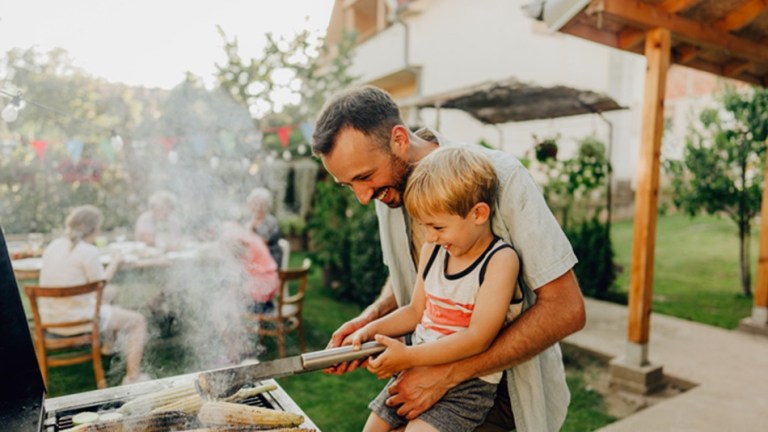 father and son bbq backyard